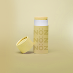 Load image into Gallery viewer, Straight view of Nöz sunscreen in yellow with its cap off.
